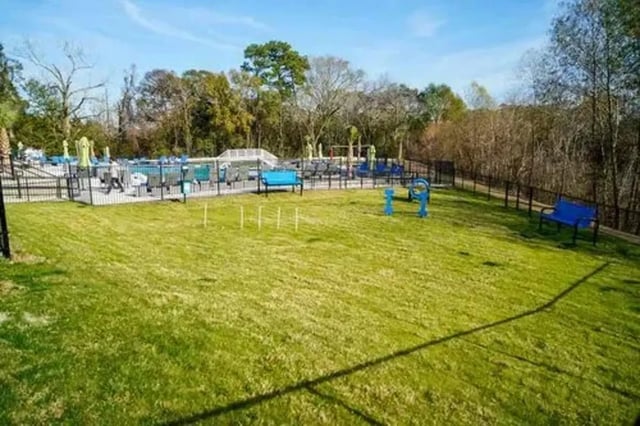 Dog park area with agility equipment and benches outdoor play area at The Pointe at Pinhook in Lafayette Student Accommodation