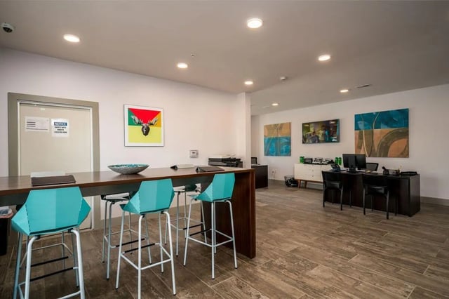 Bar seating with desks and art lounge area at The Rocks in East Lansing Student Accommodation