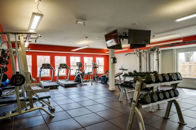 Dumbbells treadmills weight machine gym area at The Rocks in East Lansing Student Accommodation
