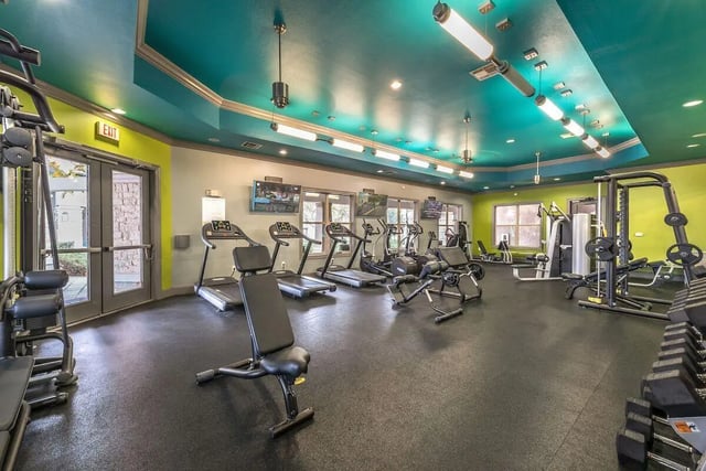 Treadmills weight machines and free weights gym at Forum at Denton Station in Denton Student Accommodation