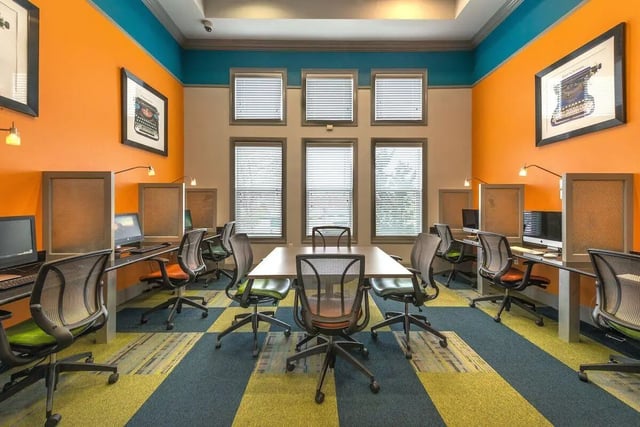 Computers desks chairs and windows study area at Forum at Denton Station in Denton Student Accommodation