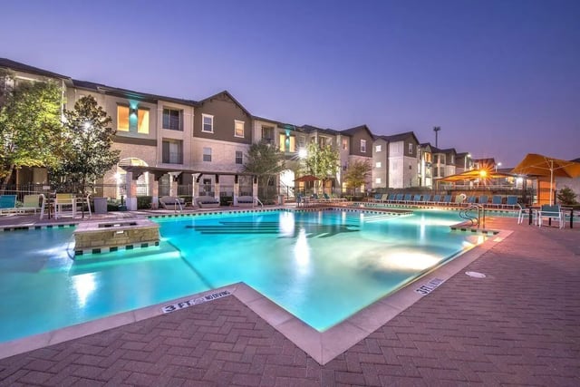 Large pool with lounge chairs exterior at Forum at Denton Station in Denton Student Accommodation