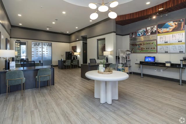 Reception desk with chairs and decorative table interior. at Forum at Tallahassee in Tallahassee Student Accommodation