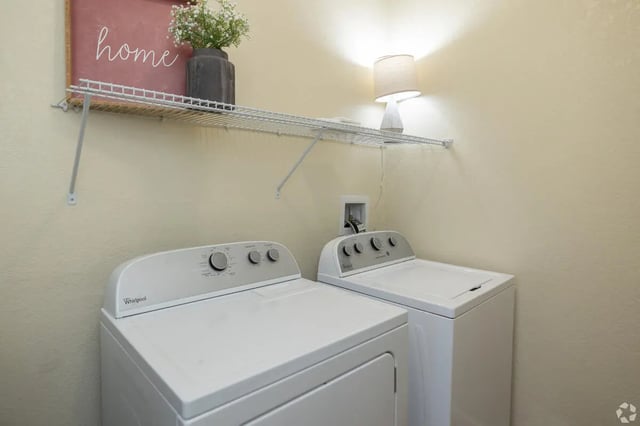 Washer dryer decorative shelf lamp Laundry Room at Forum at Tallahassee in Tallahassee Student Accommodation