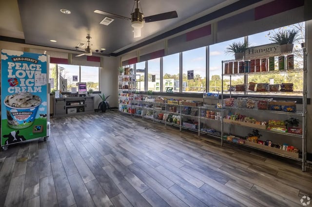 Ice cream freezer shelves and checkout counter amenity area at Forum at Tallahassee in Tallahassee Student Accommodation