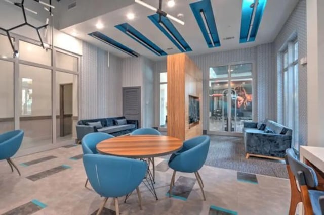 Blue chairs round table sofas lounge area at The Icon & Lofts at the Icon in Houston Student Accommodation