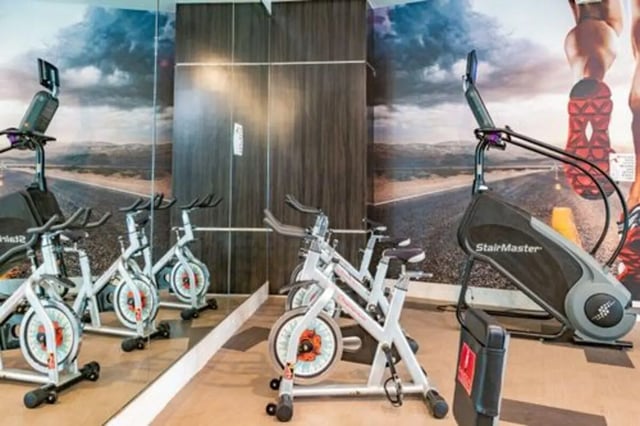 Spin bikes and StairMaster gym playing area at The Icon & Lofts at the Icon in Houston Student Accommodation