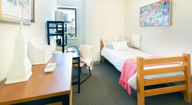Desk bed shelving and artwork bedroom at 100 Midtown in Atlanta Student Accommodation