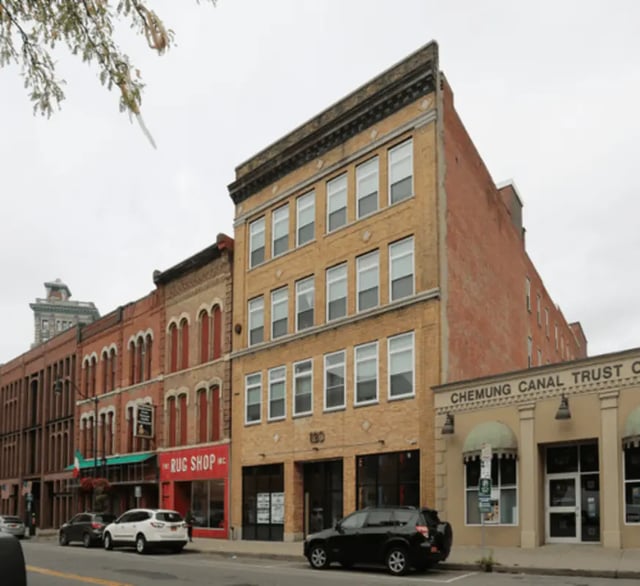 Apartment building exterior with tan brick facade exterior at Stonebridge Campus Living - Binghamton in Binghamton Student Accommodation