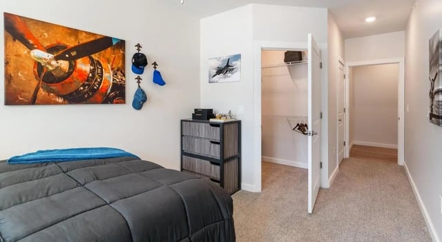 Bed closet and dresser bedroom at The Vanguard in Cincinnati Student Accommodation