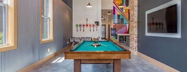 Billiard table foosball tv colorful wall art recreation area at The Vanguard in Cincinnati Student Accommodation