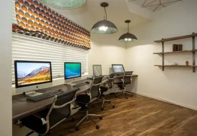 Computers and chairs in a study room at The Junction At Iron Horse Student Housing in Tucson Student Accommodation
