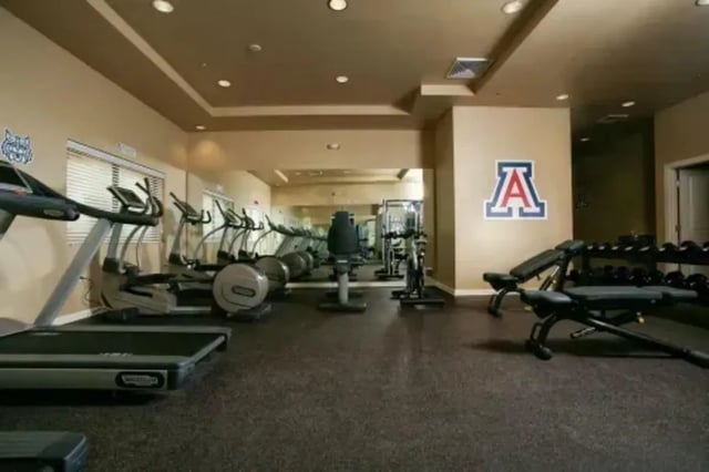 Treadmills ellipticals weights gym area at The Junction At Iron Horse Student Housing in Tucson Student Accommodation