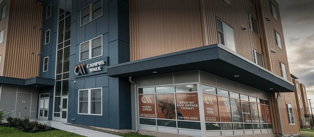 Modern student housing building exterior with signage at Campus Walk Apartments in Buffalo Student Accommodation