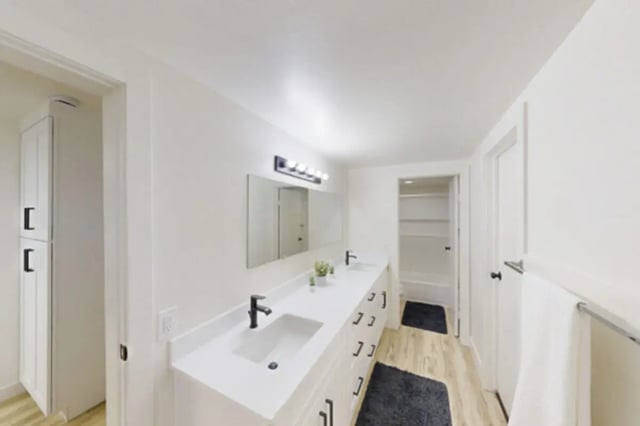 Double vanity cabinets mirror and tub bathroom at Bountiful Court Apartments in Provo Student Accommodation