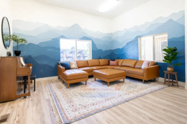 Brown sectional sofa rug piano living room at Bountiful Court Apartments in Provo Student Accommodation