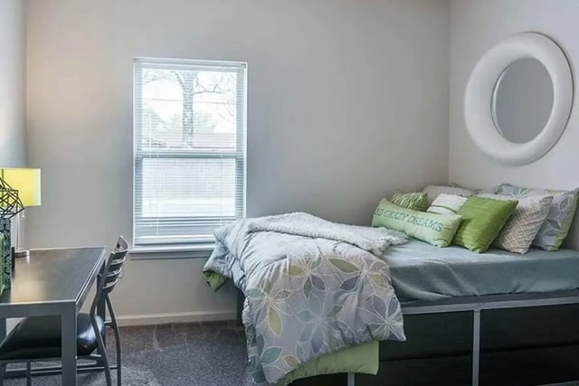 Desk bed window mirror student accommodation bedroom at The Edge at Conway in Conway Student Accommodation