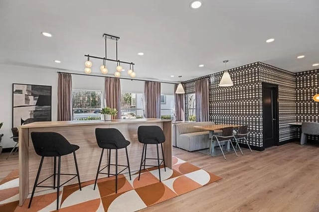Bar stools dining table and booth seating area at Arches On The Lake Student Living in Athens Student Accommodation