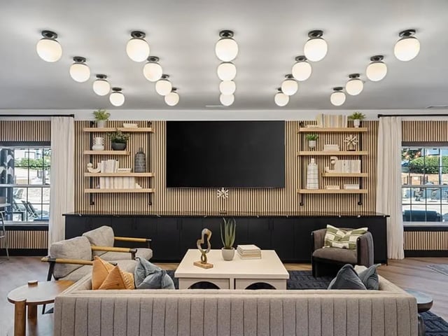 Sofa chairs TV shelves and coffee table lounge at Arches On The Lake Student Living in Athens Student Accommodation