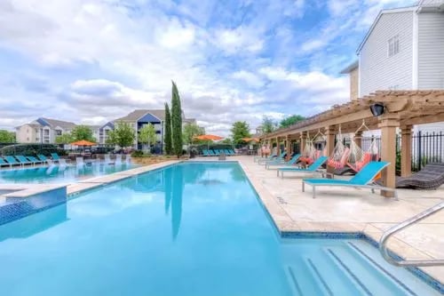 Pool loungers hammocks pergola outdoor leisure area at The Reserve San Antonio in San Antonio Student Accommodation