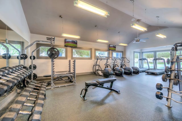 Dumbbells weight rack treadmills elliptical gym fitness center at The Reserve San Antonio in San Antonio Student Accommodation