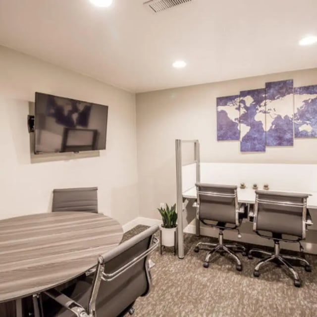 Table chairs TV world map study area at Campus Way in Provo Student Accommodation