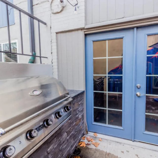 Grill and blue French doors exterior at Campus Way in Provo Student Accommodation