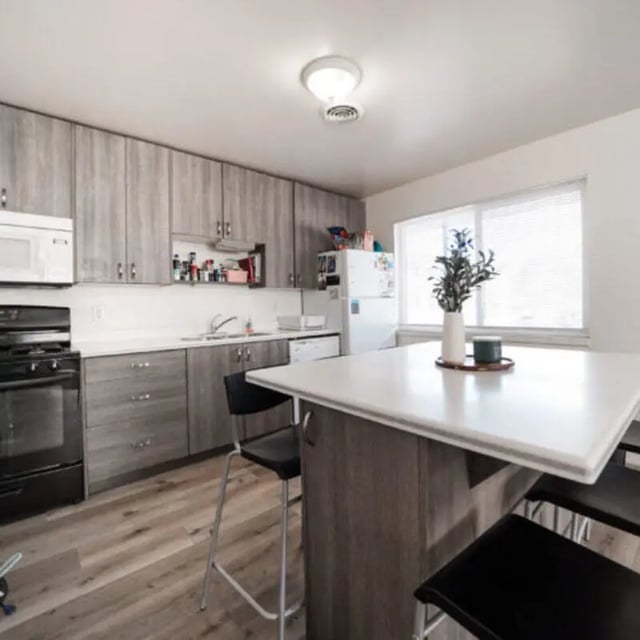 Modern kitchen with island stove fridge kitchen at Campus Way in Provo Student Accommodation