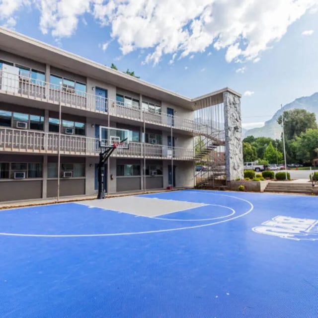 Building with balconies basketball court exterior at Campus Way in Provo Student Accommodation