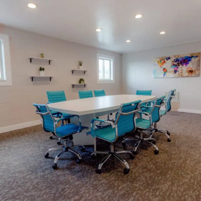 White table teal chairs world map study area at Campus Way in Provo Student Accommodation
