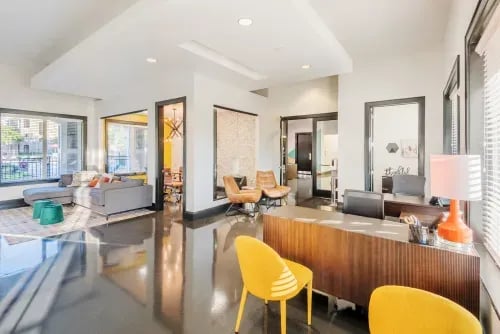Lobby with sectional sofa and reception desk lobby at The Letterman Greensboro in Greensboro Student Accommodation