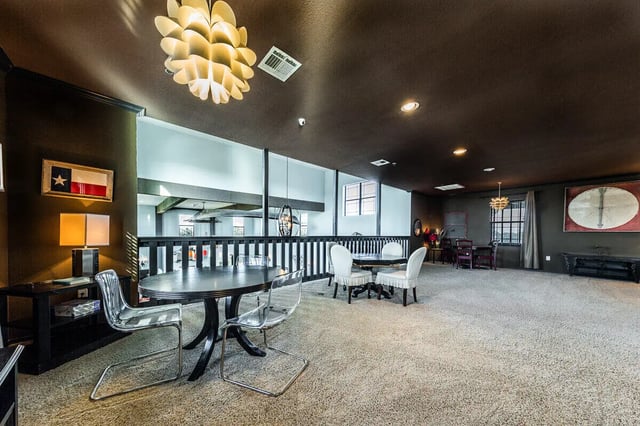 Round table with clear chairs dining area at The Reserve at College Station in College Station Student Accommodation
