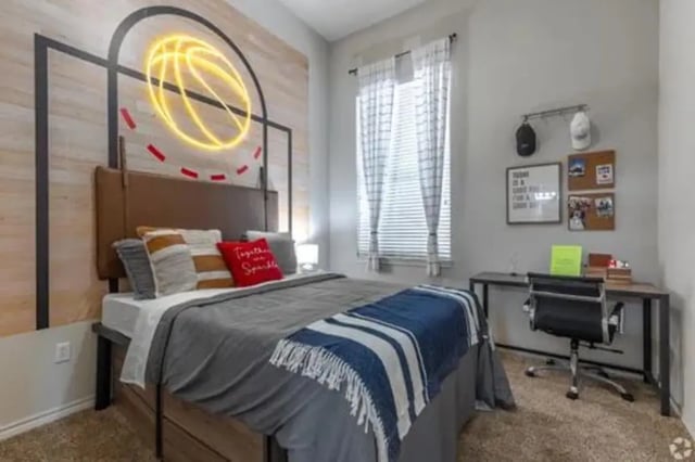 Bed with basketball art and desk Bedroom at The Centre Suites in Lubbock Student Accommodation