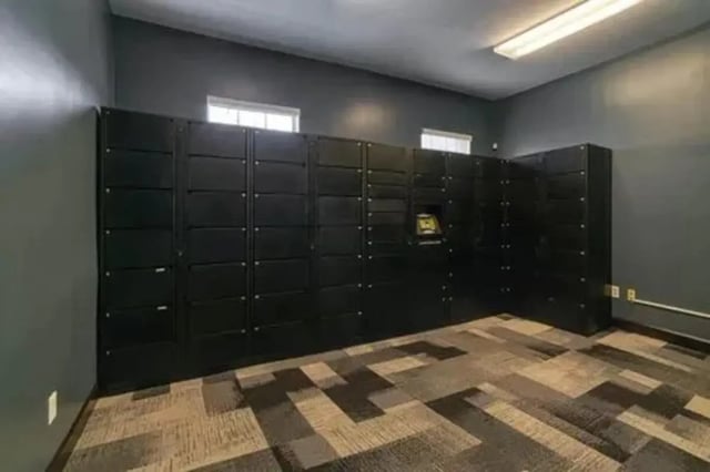 Black lockers with digital screen package area at Arden Villas in Orlando Student Accommodation