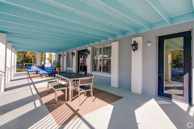 Patio table blue couch outdoor living area exterior at Arden Villas in Orlando Student Accommodation