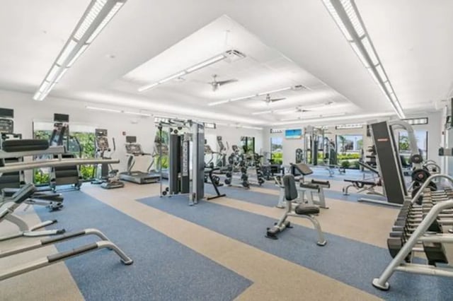 Gym equipment with treadmills and weights gymnasium at The Residences at University Village in Fort Myers Student Accommodation