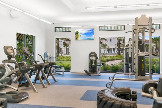 Various gym machines and a tire gym playing area at The Residences at University Village in Fort Myers Student Accommodation