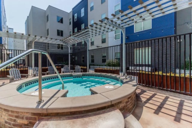 Hot tub with seating and pergola exterior at CollegePlace Provo in Provo Student Accommodation