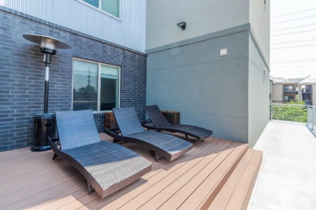 Deck with lounge chairs and patio heater exterior at CollegePlace Provo in Provo Student Accommodation