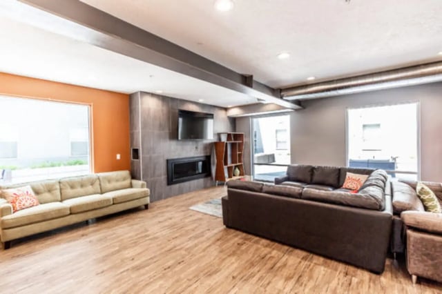 Sofas television fireplace bookshelves living room at CollegePlace Provo in Provo Student Accommodation