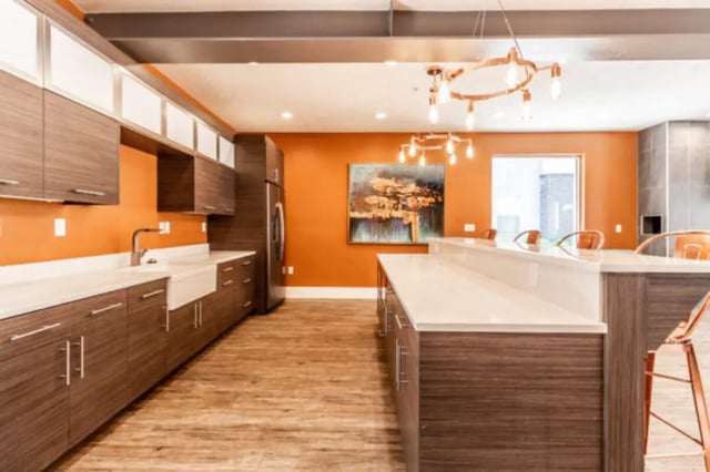 Modern kitchen with island artwork and cabinets Kitchen at CollegePlace Provo in Provo Student Accommodation
