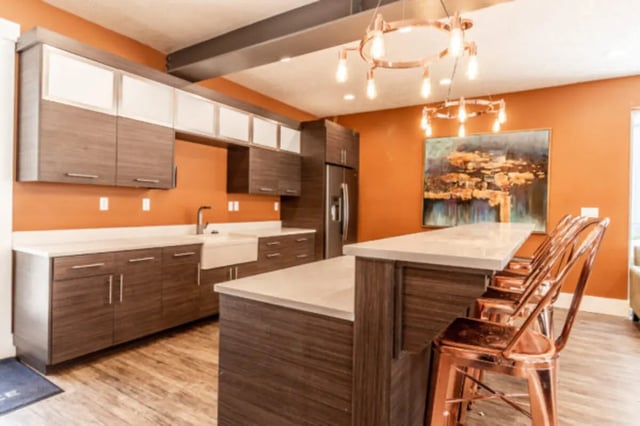 Modern kitchen with island, sink, and chairs kitchen at CollegePlace Provo in Provo Student Accommodation