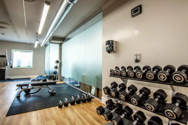 Dumbbells weights bench and exercise equipment gym at CollegePlace Provo in Provo Student Accommodation