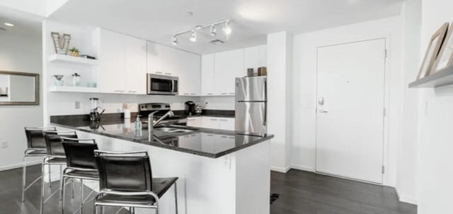Modern kitchen with island seating and appliances kitchen at Vertex Apartments in Tallahassee Student Accommodation