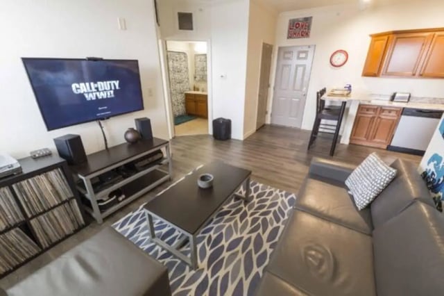 TV couch coffee table kitchen living room at CollegePlace Uptown