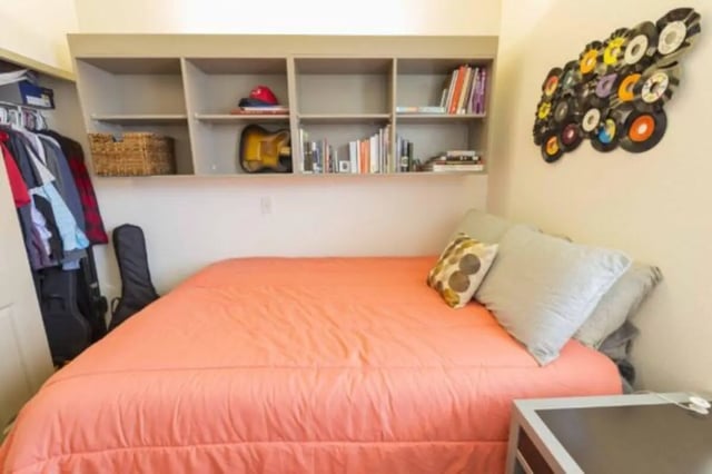 Bed wardrobe guitar shelves and vinyl record art bedroom at CollegePlace Uptown