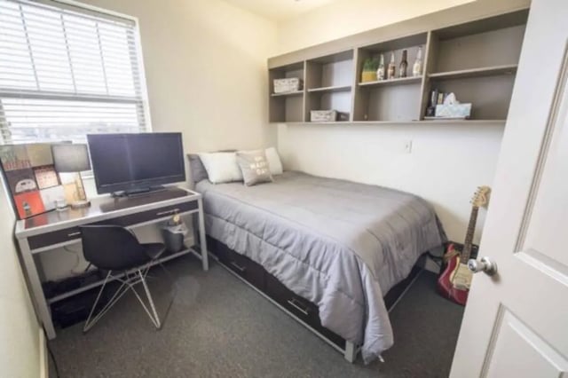 Desk bed guitar and shelves bedroom at CollegePlace Uptown