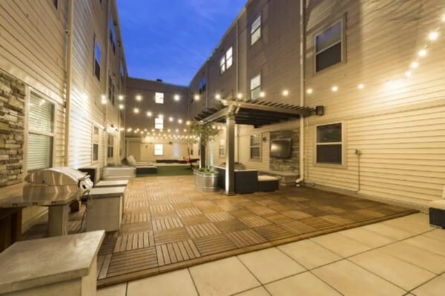 Grill seating lounge area and patio lights exterior at CollegePlace Uptown
