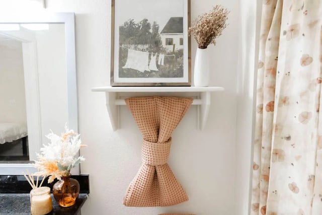 Artwork vase towel and curtain Bathroom at The Lodge Apartments in San Marcos Student Accommodation