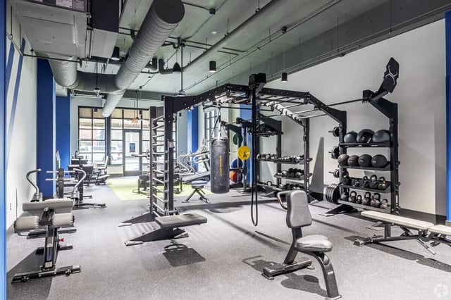 Weight racks punching bag and exercise equipment gym at Vic Village South in Ann Arbor Student Accommodation